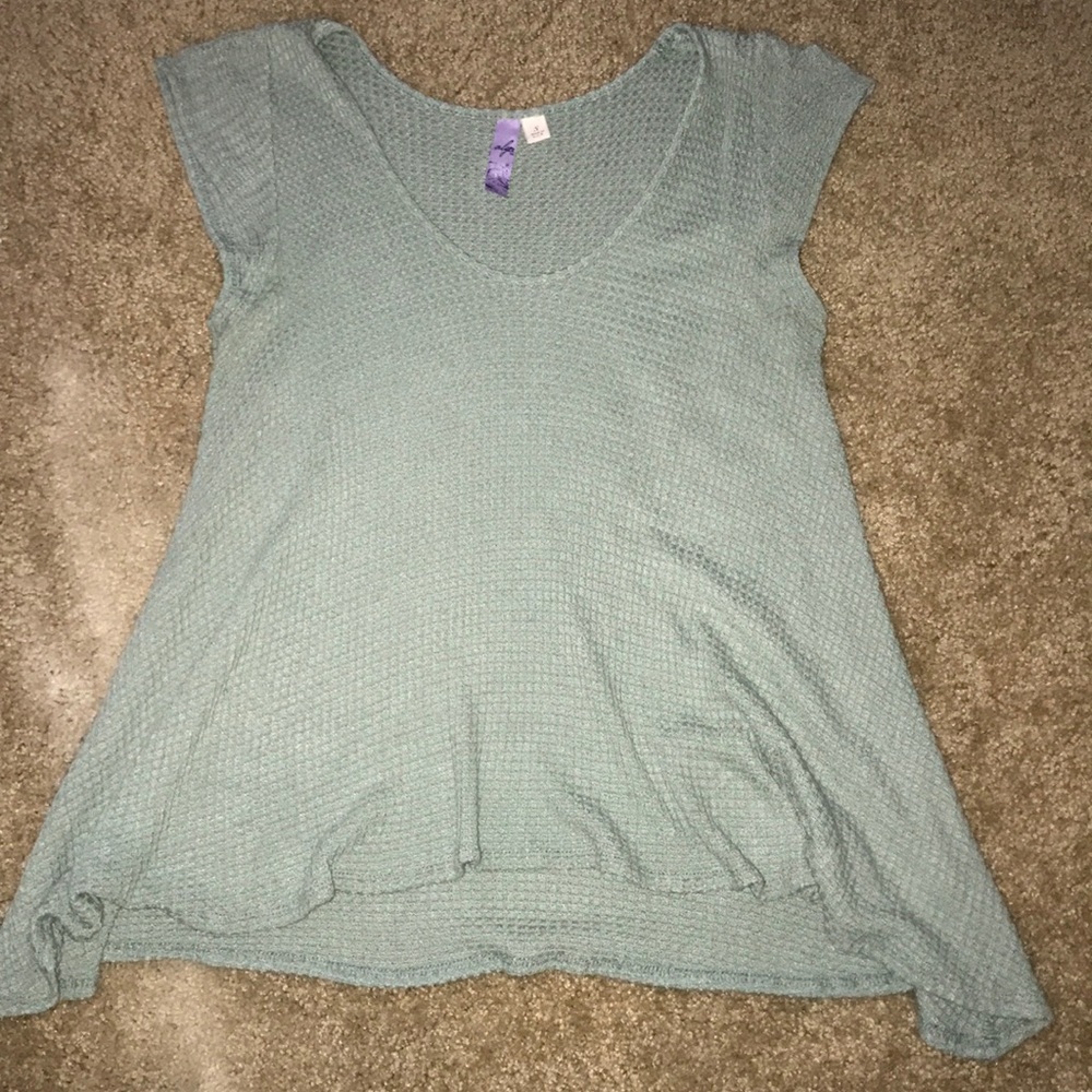 Francesca’s greenish shirt